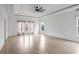 Spacious main bedroom featuring hardwood floors and a ceiling fan at 2733 Caldwell Rd, Brookhaven, GA 30319