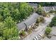 Aerial view of townhomes surrounded by lush, mature trees in a well-maintained community at 2927 Torreya Se Way, Marietta, GA 30067