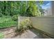 A backyard with a privacy fence, some stone steps, and mature foliage at 2927 Torreya Se Way, Marietta, GA 30067