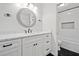 Modern bathroom with sleek vanity, decorative mirror, and tiled shower/tub combo at 2927 Torreya Se Way, Marietta, GA 30067