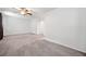 Large main bedroom featuring neutral carpeting, ceiling fan and generous closet space at 2927 Torreya Se Way, Marietta, GA 30067