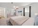 Bright main bedroom boasts generous closet space, serene colors, and ensuite bathroom at 2927 Torreya Se Way, Marietta, GA 30067