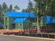 Exterior view of a new construction home with green sheathing and blue roof covering at 150 Cedarwood Ln, Roswell, GA 30075