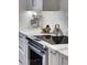 Modern kitchen detail with marble countertop and appliances at 2660 Peachtree Nw Rd # 26F, Atlanta, GA 30305