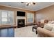 Living room with hardwood floors, fireplace, and lots of natural light at 283 Brownstone Cir, Marietta, GA 30008