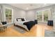 Bright bedroom featuring hardwood floors and ample natural light at 918 Cannongate Sw Xing, Marietta, GA 30064