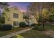 Evening view of a yellow two-story building with stairs and landscaping at 918 Cannongate Sw Xing, Marietta, GA 30064