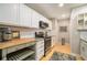 Updated kitchen featuring granite countertops and wood cabinetry at 918 Cannongate Sw Xing, Marietta, GA 30064