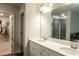 Bathroom with dual sinks, white cabinetry, quartz countertops, and tile flooring at 3004 Amabile Rd, Dacula, GA 30019
