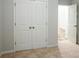 Carpeted bedroom with neutral walls and double-door closet for ample storage at 3004 Amabile Rd, Dacula, GA 30019