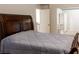 Spacious bedroom boasts plush carpet and a bed with dark wood frame at 3004 Amabile Rd, Dacula, GA 30019