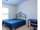 Bedroom featuring a bed with blue linens, a window and dark wood desk at 3004 Amabile Rd, Dacula, GA 30019