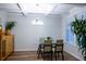 Bright dining room featuring a modern chandelier, hardwood floors, and large window at 3004 Amabile Rd, Dacula, GA 30019