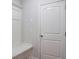 A clean and functional entryway featuring coat storage, bench seating, and a closet at 3004 Amabile Rd, Dacula, GA 30019