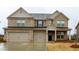 Beautiful two-story brick home with attached two-car garage and covered front porch at 3004 Amabile Rd, Dacula, GA 30019