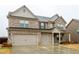 Attractive two-story home with a brick facade, a two-car garage, and a well-manicured lawn at 3004 Amabile Rd, Dacula, GA 30019
