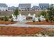 Community firepit area with chairs and a beautiful stone walkway for neighborly relaxation at 3004 Amabile Rd, Dacula, GA 30019