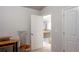 Hallway with a view of the wood and iron banister staircase and multiple doors at 3004 Amabile Rd, Dacula, GA 30019