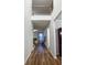 Hallway with hardwood floors leading to living room at 3004 Amabile Rd, Dacula, GA 30019