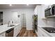 Kitchen boasts white cabinets, stainless appliances, and direct access to the pantry at 3004 Amabile Rd, Dacula, GA 30019