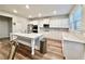 Modern kitchen with white cabinets, quartz countertops, and island at 3004 Amabile Rd, Dacula, GA 30019