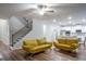 Living room adjacent to the kitchen and a stairway with wood and iron handrail at 3004 Amabile Rd, Dacula, GA 30019