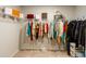 Walk-in closet with hanging racks, shelving and storage for clothing and accessories at 3004 Amabile Rd, Dacula, GA 30019