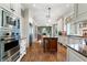 Large kitchen with stainless steel appliances and hardwood floors at 1446 W Wesley Nw Rd, Atlanta, GA 30327