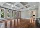 Bright living room with hardwood floors, large windows, and coffered ceiling at 1446 W Wesley Nw Rd, Atlanta, GA 30327