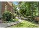 Relaxing pool area with a grassy lawn and walkway at 1446 W Wesley Nw Rd, Atlanta, GA 30327