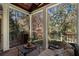 Relaxing screened porch with wooded views and built-in grill at 1446 W Wesley Nw Rd, Atlanta, GA 30327