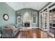 Cozy sitting room with fireplace and hardwood floors and French doors at 1446 W Wesley Nw Rd, Atlanta, GA 30327