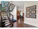 Modern staircase leading down to finished basement at 1500 W Wesley Nw Rd, Atlanta, GA 30327