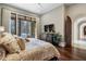 Spacious main bedroom with hardwood floors and access to the pool at 1500 W Wesley Nw Rd, Atlanta, GA 30327