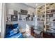 Modern home office with built-in shelving, glass desk, and inspirational wall art at 1500 W Wesley Nw Rd, Atlanta, GA 30327