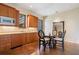 Basement kitchenette with wood cabinets and small table at 1500 W Wesley Nw Rd, Atlanta, GA 30327