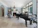 Spacious living room featuring a fireplace and grand piano at 1500 W Wesley Nw Rd, Atlanta, GA 30327