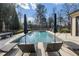 Inviting swimming pool with lounge chairs and patio umbrella at 1500 W Wesley Nw Rd, Atlanta, GA 30327