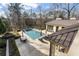 Inviting pool area with ample lounging space and a view of the surrounding landscape at 1500 W Wesley Nw Rd, Atlanta, GA 30327