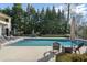 Inviting swimming pool with surrounding patio and lounge chairs at 1500 W Wesley Nw Rd, Atlanta, GA 30327