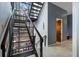 Modern staircase with glass and metal accents, offering abundant natural light at 1500 W Wesley Nw Rd, Atlanta, GA 30327