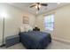 Spacious bedroom with a full-size bed and ceiling fan at 2125 Jessica Way, Lithonia, GA 30058