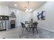 Modern dining area with glass table and four chairs, located near kitchen at 2125 Jessica Way, Lithonia, GA 30058