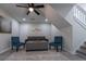 Living room with gray couch, teal chairs, and a stone fireplace at 2125 Jessica Way, Lithonia, GA 30058