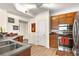 Modern kitchen features stainless steel appliances, wooden cabinets, and granite countertops at 234 Ashford Cir, Atlanta, GA 30338