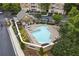 Inviting community pool surrounded by lounge chairs and greenery at 234 Ashford Cir, Atlanta, GA 30338