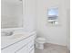 Bright bathroom with white vanity, toilet and bathtub at 283 Boulder Park Ln, Atlanta, GA 30331