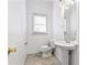 Simple bathroom with pedestal sink and toilet at 283 Boulder Park Ln, Atlanta, GA 30331