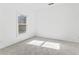 Bright bedroom with neutral carpet and large window at 283 Boulder Park Ln, Atlanta, GA 30331