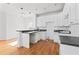 White kitchen with hardwood floors and island at 283 Boulder Park Ln, Atlanta, GA 30331